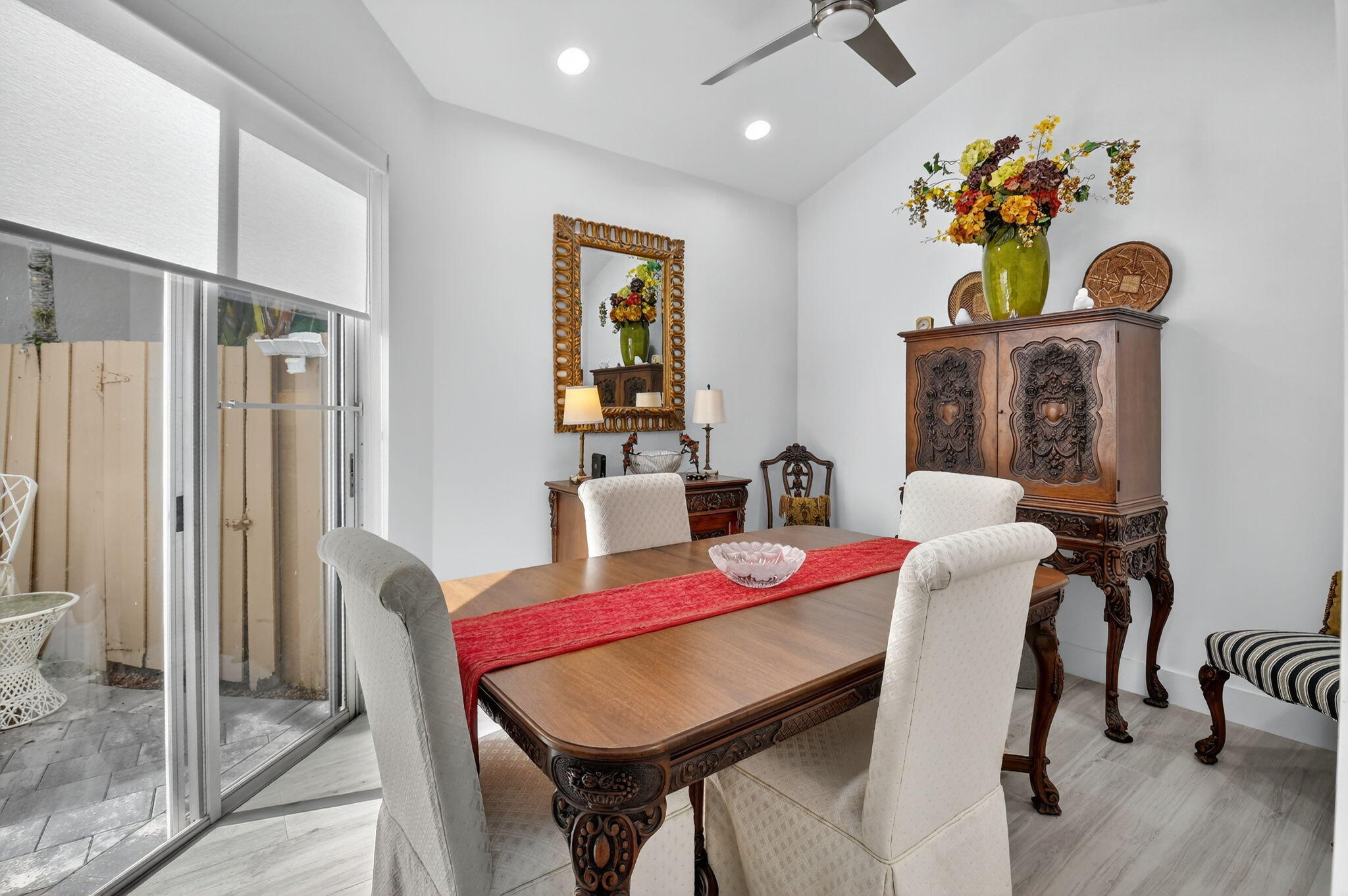 6668 Northwest 25th Terrace Boca Raton, FL 33496 - Photo 19 of 53 a view of a dining room with furniture and wooden floor