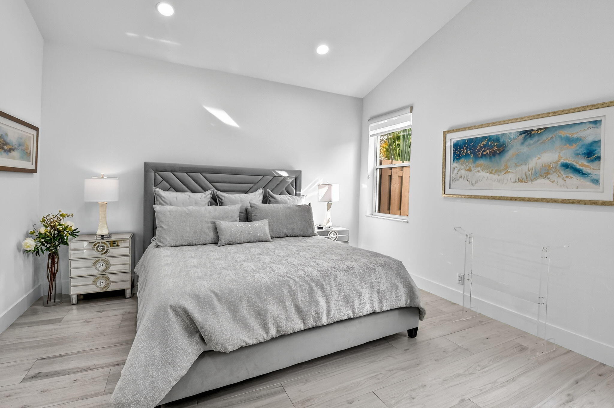 6668 Northwest 25th Terrace Boca Raton, FL 33496 - Photo 20 of 53 a bedroom with a bed and wooden floor