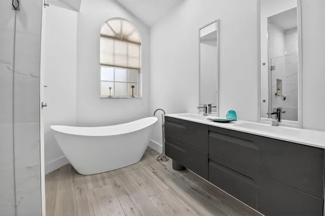 a bathroom with a shower and a sink