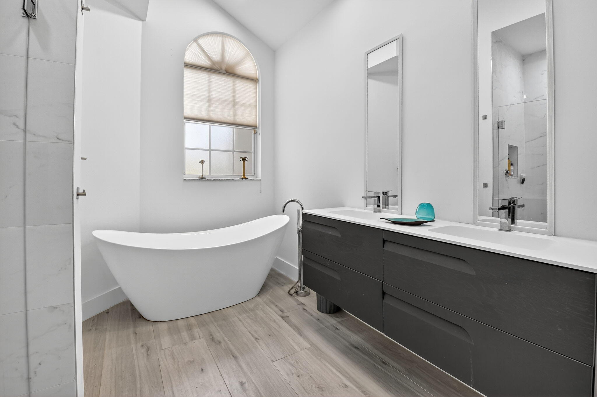 6668 Northwest 25th Terrace Boca Raton, FL 33496 - Photo 21 of 53 a bathroom with a bathtub and a sink