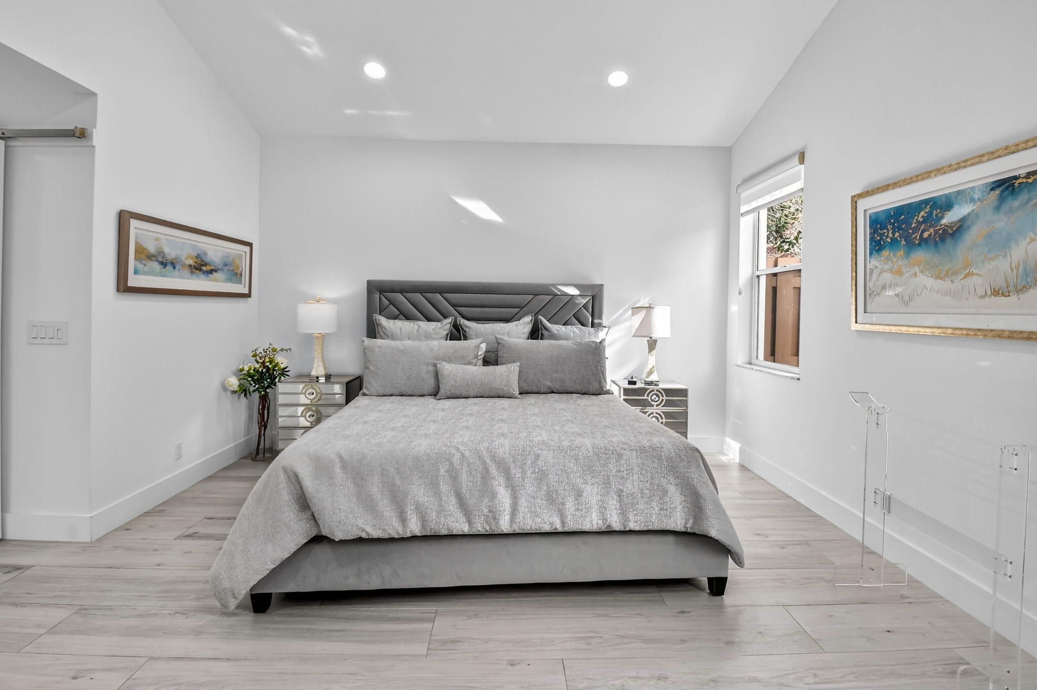 6668 Northwest 25th Terrace Boca Raton, FL 33496 - Photo 25 of 53 a bedroom with a bed and painting on the wall