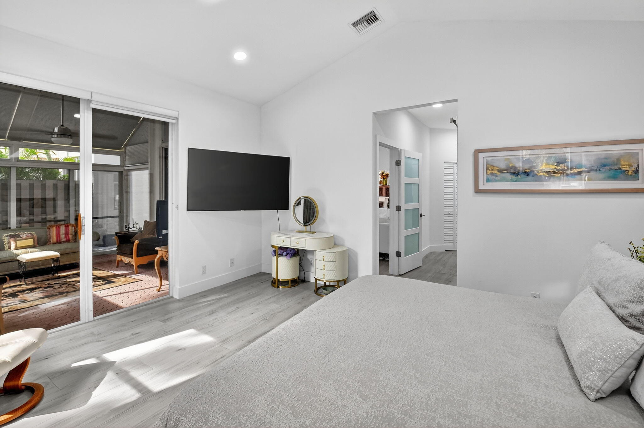 6668 Northwest 25th Terrace Boca Raton, FL 33496 - Photo 28 of 53 a bedroom with a bed and large mirror