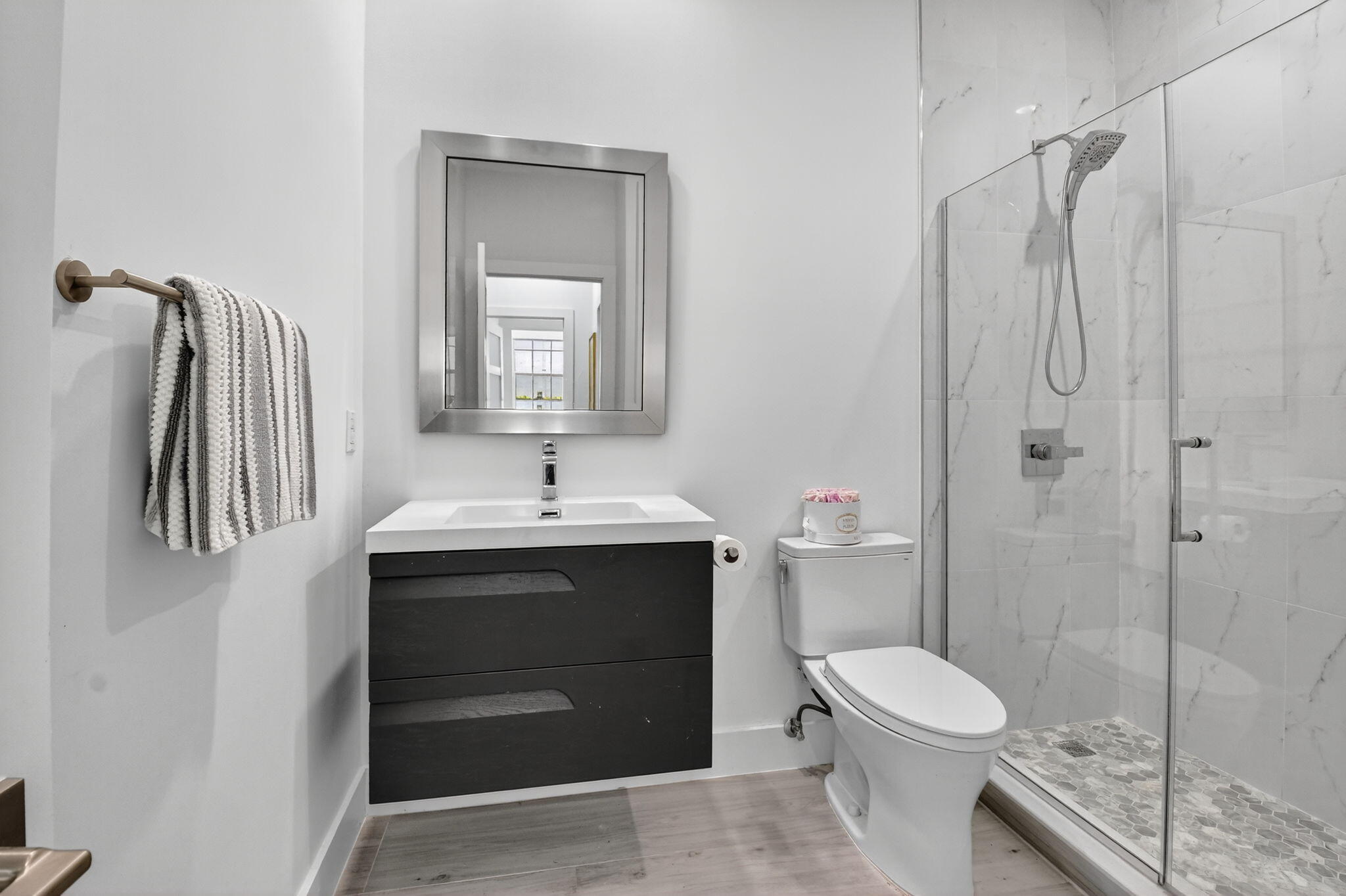 6668 Northwest 25th Terrace Boca Raton, FL 33496 - Photo 32 of 53 a bathroom with a sink a toilet and shower