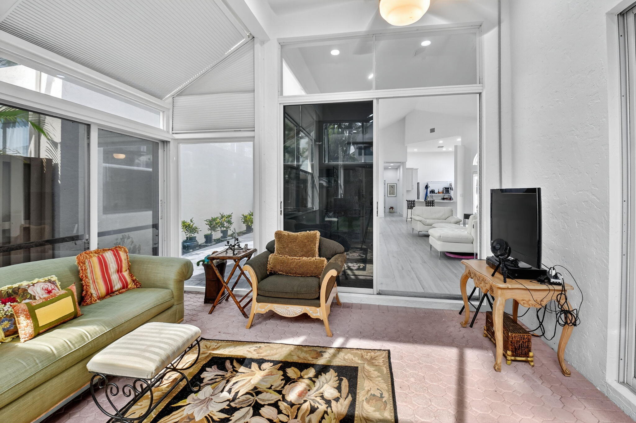 6668 Northwest 25th Terrace Boca Raton, FL 33496 - Photo 36 of 53 a living room with furniture and a flat screen tv