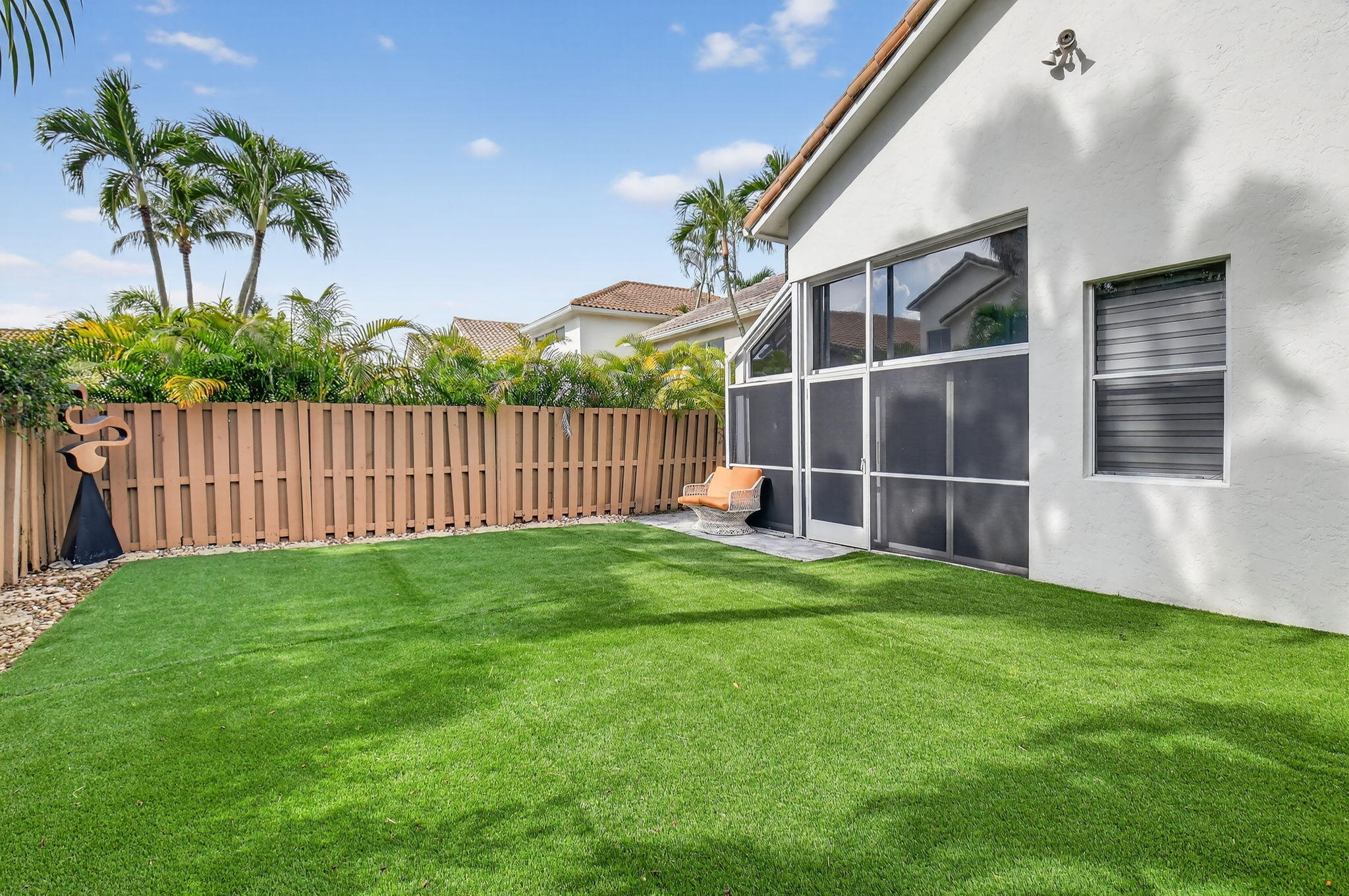 6668 Northwest 25th Terrace Boca Raton, FL 33496 - Photo 42 of 53 a view of an house with backyard and a garden