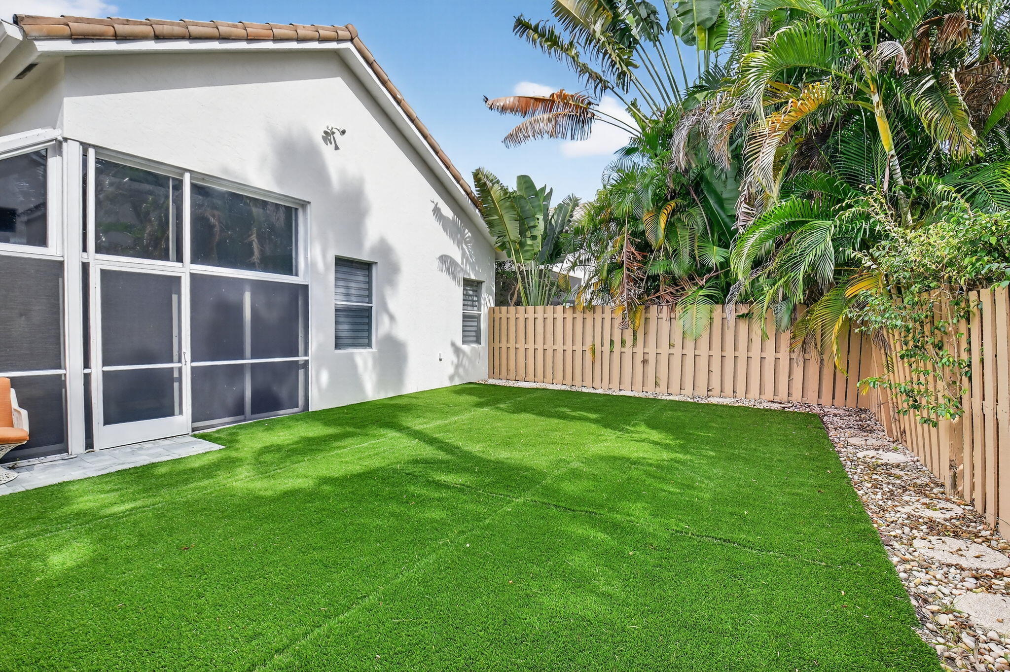 6668 Northwest 25th Terrace Boca Raton, FL 33496 - Photo 44 of 53 a view of yard with backyard of house
