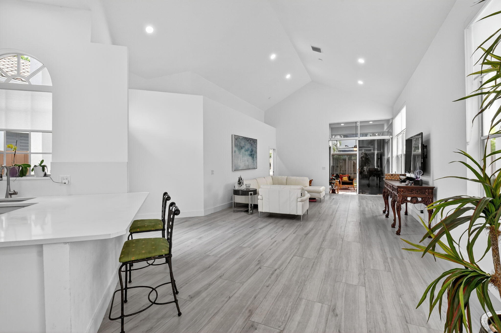 6668 Northwest 25th Terrace Boca Raton, FL 33496 - Photo 8 of 53 a living room with furniture and a wooden floor