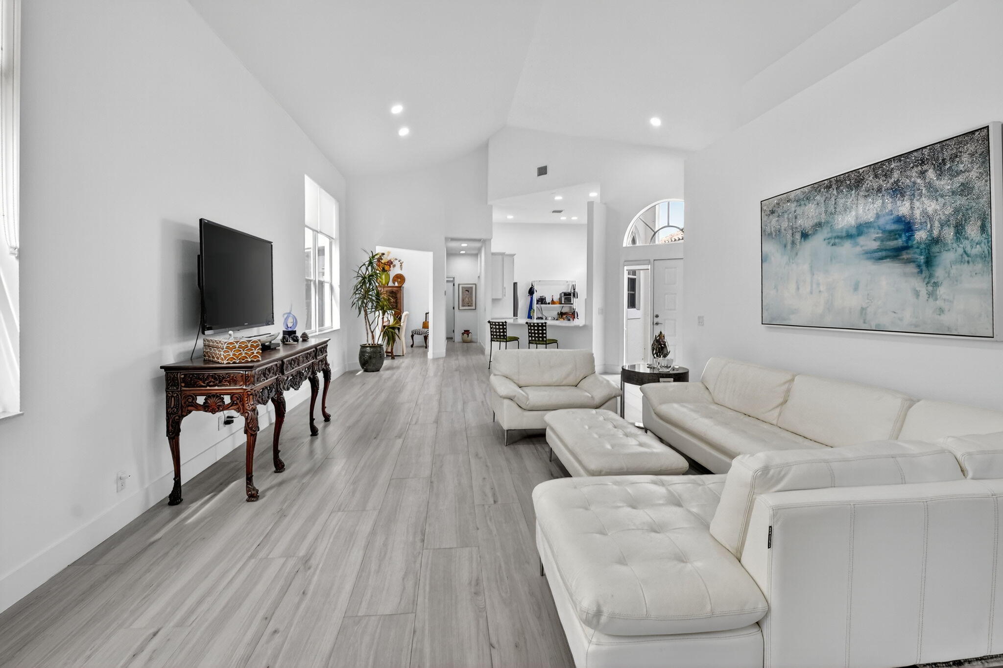 6668 Northwest 25th Terrace Boca Raton, FL 33496 - Photo 10 of 53 a living room with furniture and a flat screen tv