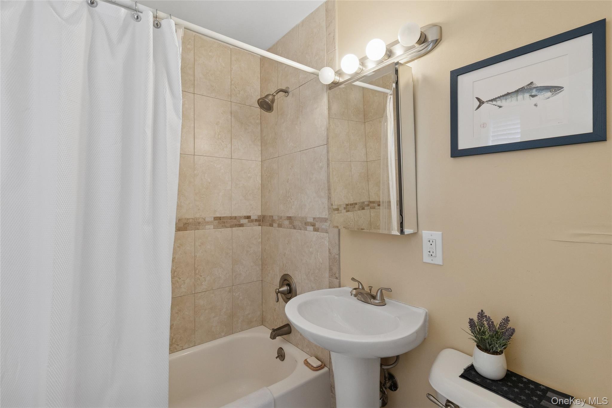 31 Amityville Road Sound Beach, NY 11789 - Photo 24 of 33 a bathroom with a sink a toilet and shower
