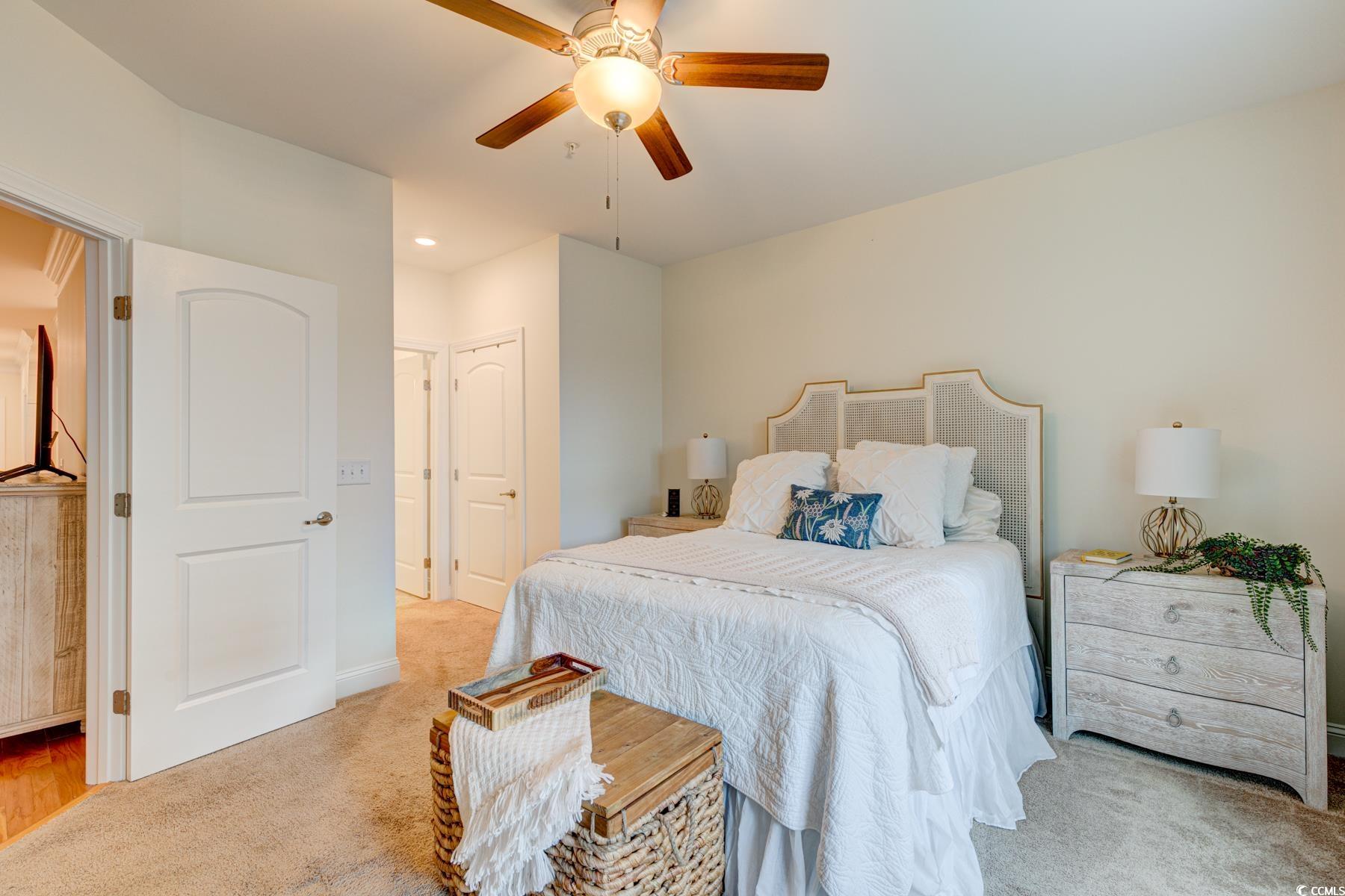 130 Puffin Drive, Unit 2B Pawleys Island, SC 29585 - Photo 23 of 34 Bedroom featuring light colored carpet, a ceiling fan, and recessed lighting