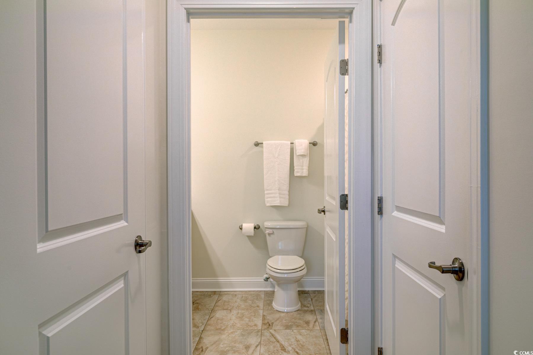 130 Puffin Drive, Unit 2B Pawleys Island, SC 29585 - Photo 24 of 34 Bathroom with baseboards and toilet