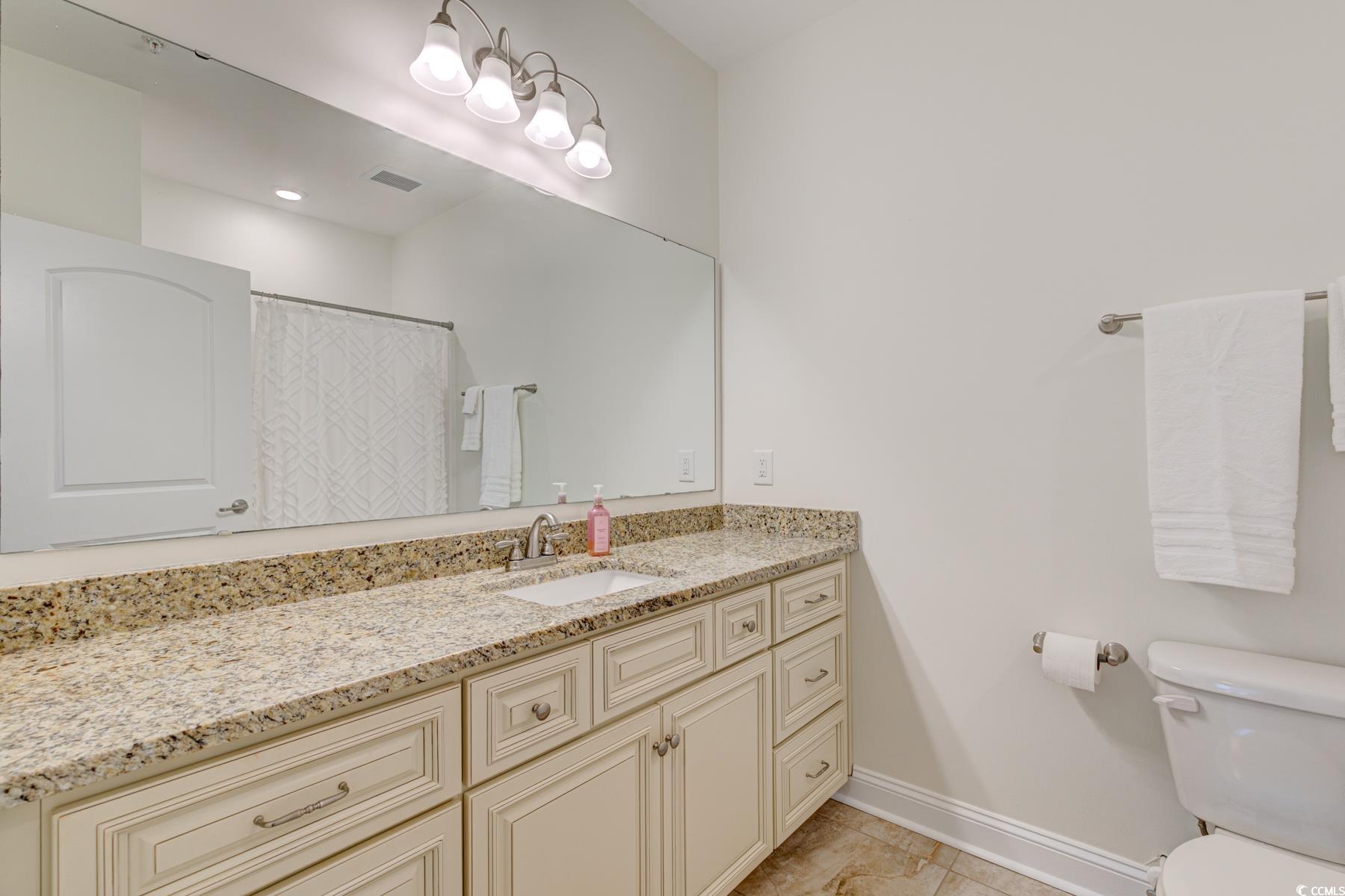 130 Puffin Drive, Unit 2B Pawleys Island, SC 29585 - Photo 25 of 34 Full bath with a shower with curtain and vanity