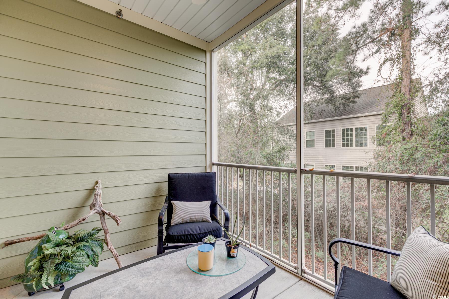 130 Puffin Drive, Unit 2B Pawleys Island, SC 29585 - Photo 29 of 34 Sunroom with a balcony
