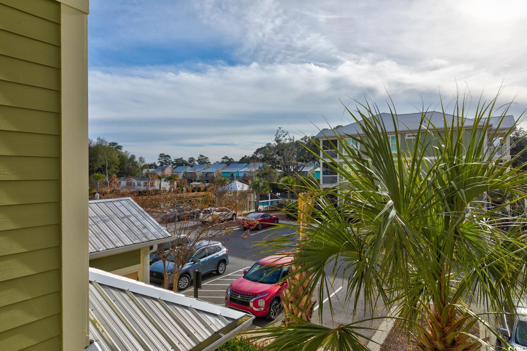 130 Puffin Drive, Unit 2B Pawleys Island, SC 29585 - Photo 30 of 34 Balcony featuring a residential view