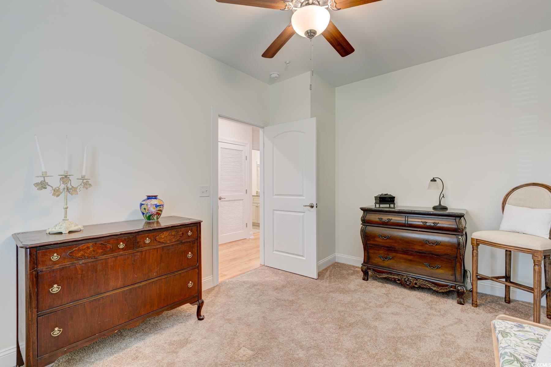 130 Puffin Drive, Unit 2B Pawleys Island, SC 29585 - Photo 6 of 34 Sitting room featuring light carpet and ceiling fan