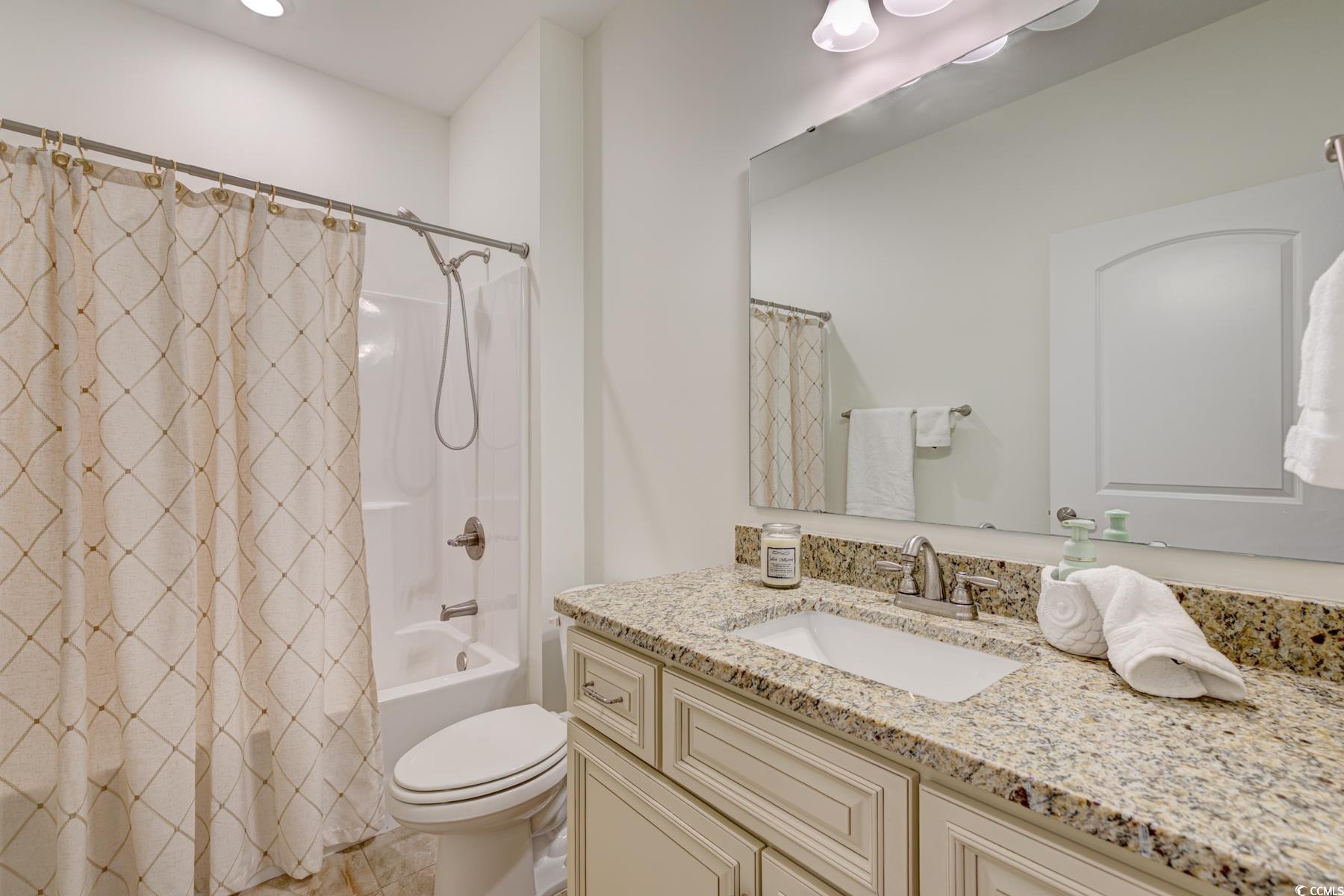 130 Puffin Drive, Unit 2B Pawleys Island, SC 29585 - Photo 8 of 34 Bathroom featuring vanity and shower / tub combo
