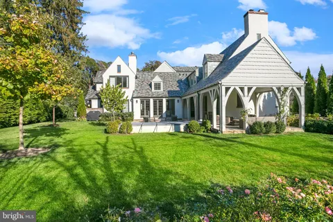 a living room with furniture a window and a table