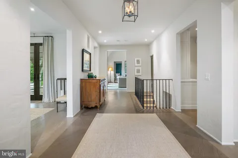 a kitchen with stainless steel appliances granite countertop a stove and a wooden floors