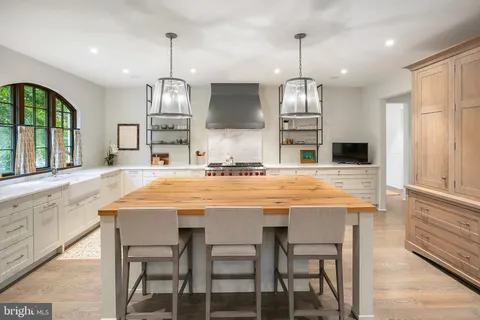 a view of hallway with wooden floor