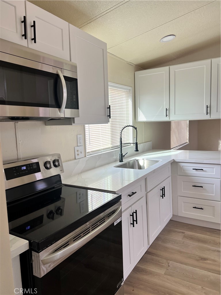 37132 Coyote Lake Road Newberry Springs, CA 92365 - Photo 40 of 45 New Quarts Kitchen Counters, Cabinets, Stove & Microwave (Dec 2025)