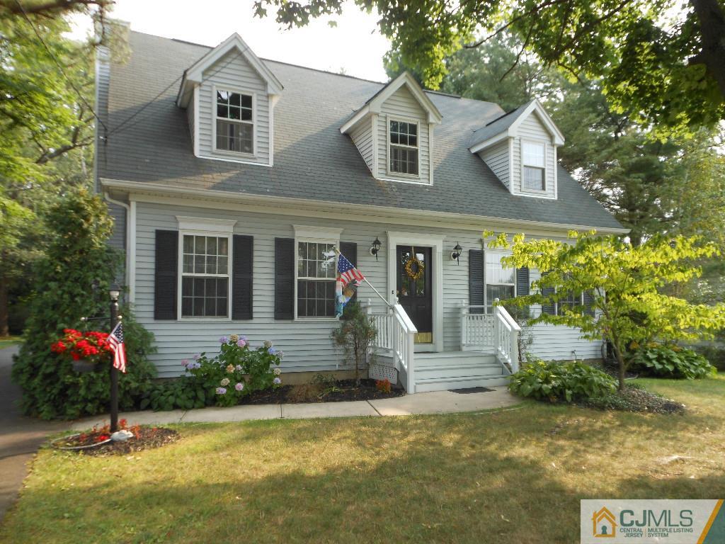 421 Ridge Road Dayton, NJ 08810 - Photo 1 of 17 a front view of a house with garden