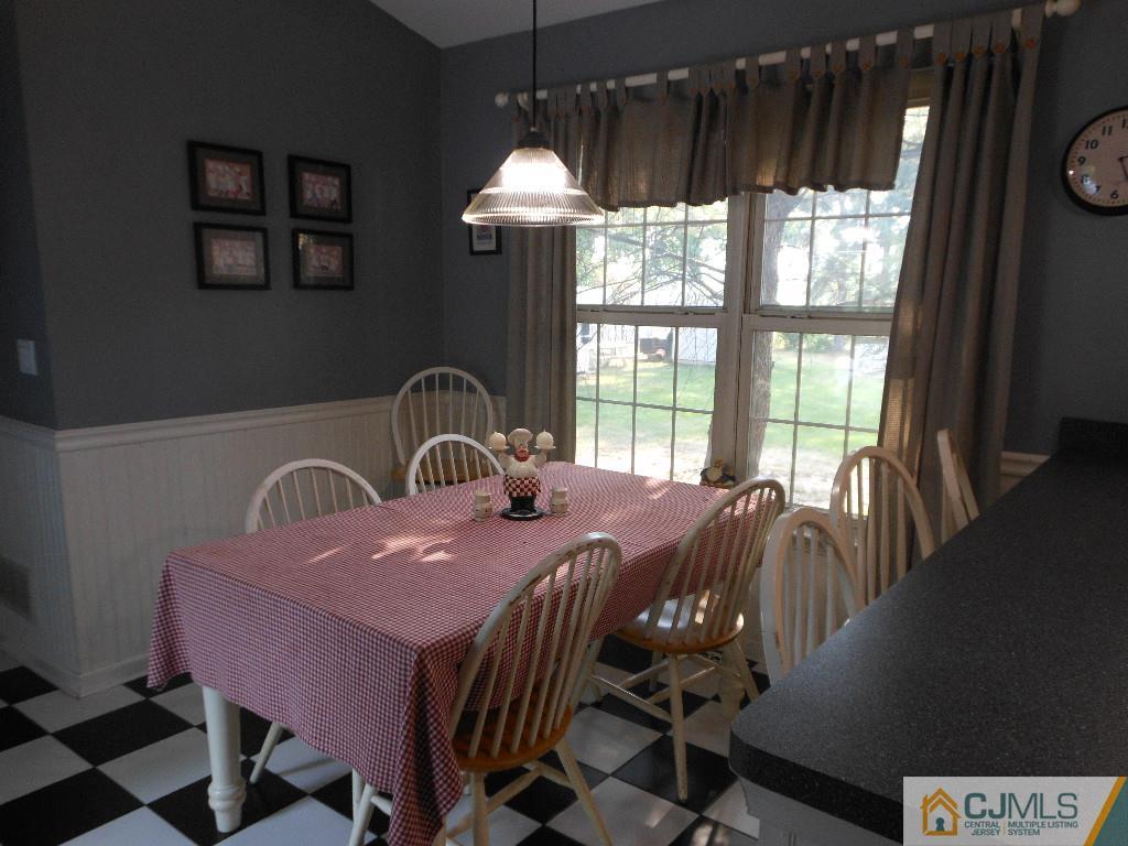 421 Ridge Road Dayton, NJ 08810 - Photo 3 of 17 a dining room with furniture and window