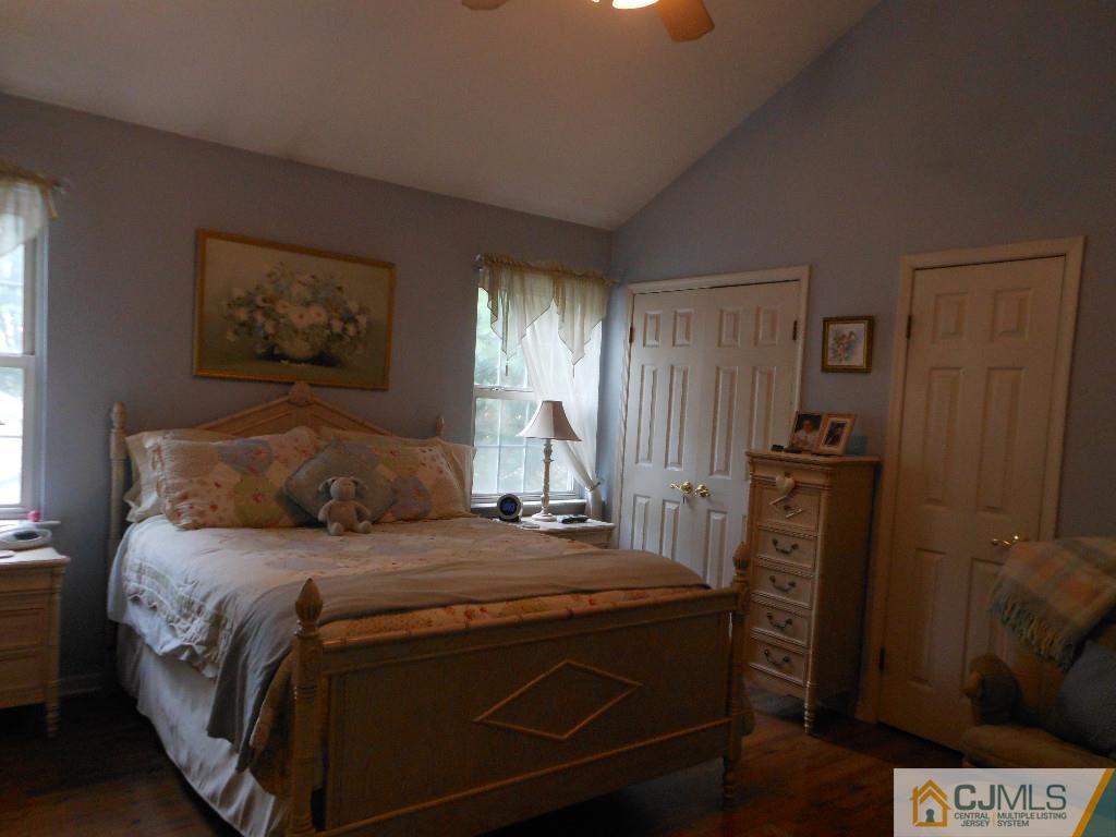 421 Ridge Road Dayton, NJ 08810 - Photo 8 of 17 a bedroom with a bed and a television