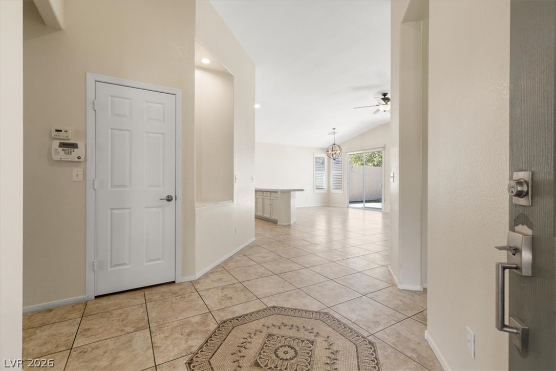 1007 Golden Ridge Court Henderson, NV 89052 - Photo 4 of 27 An inviting tiled entryway opens directly into a spacious, light-filled living area.