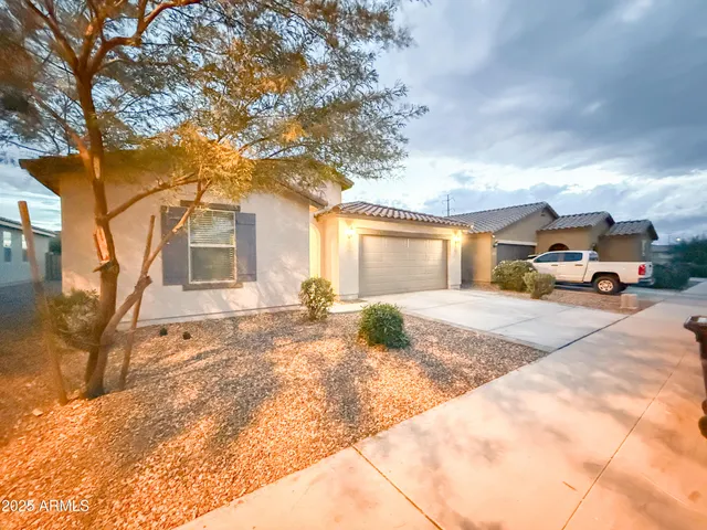 a view of a car park in front of a house
