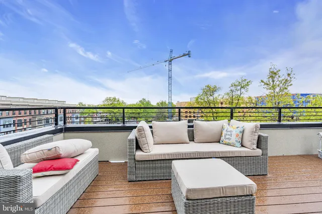 a bedroom with a bed and a lamp