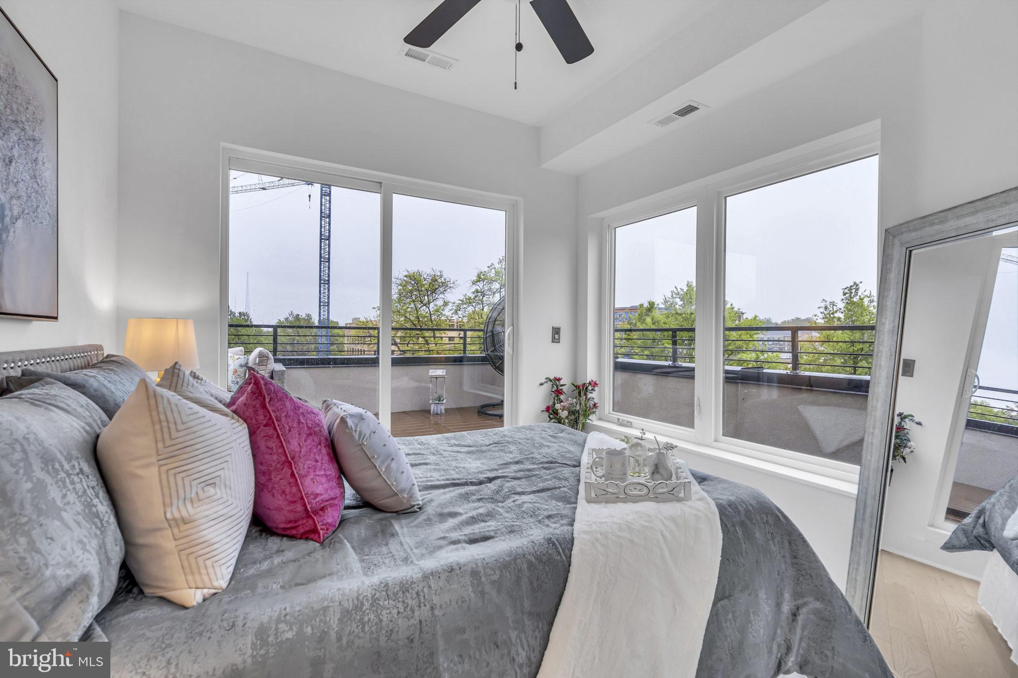 1103 Fern Street Northwest, Unit 301 Washington, DC 20012 - Photo 35 of 57 a living room with furniture and a large window