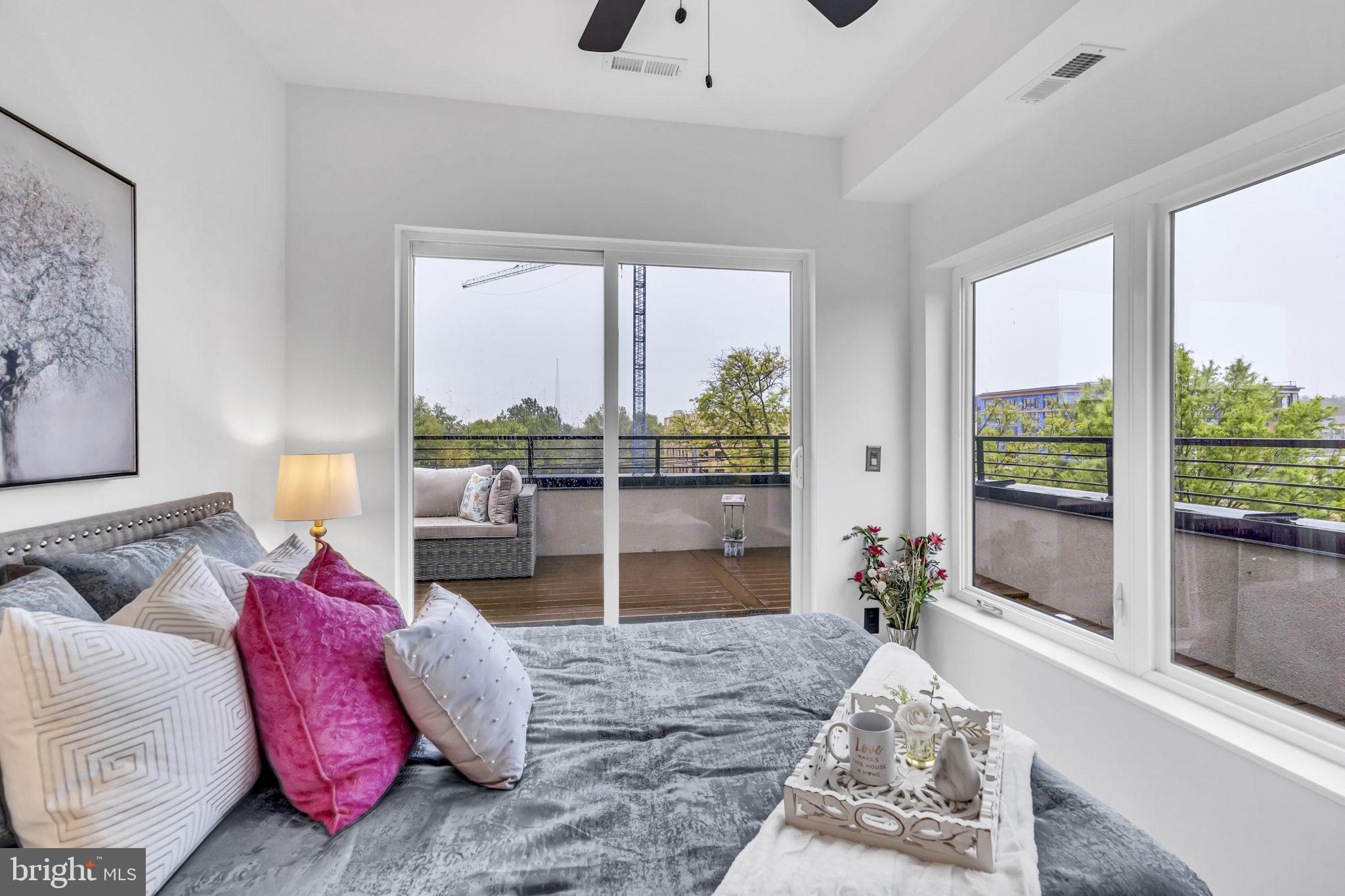 1103 Fern Street Northwest, Unit 301 Washington, DC 20012 - Photo 37 of 57 a living room with furniture and a large window