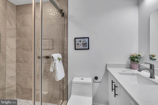 a front view of a residential apartment building with a yard