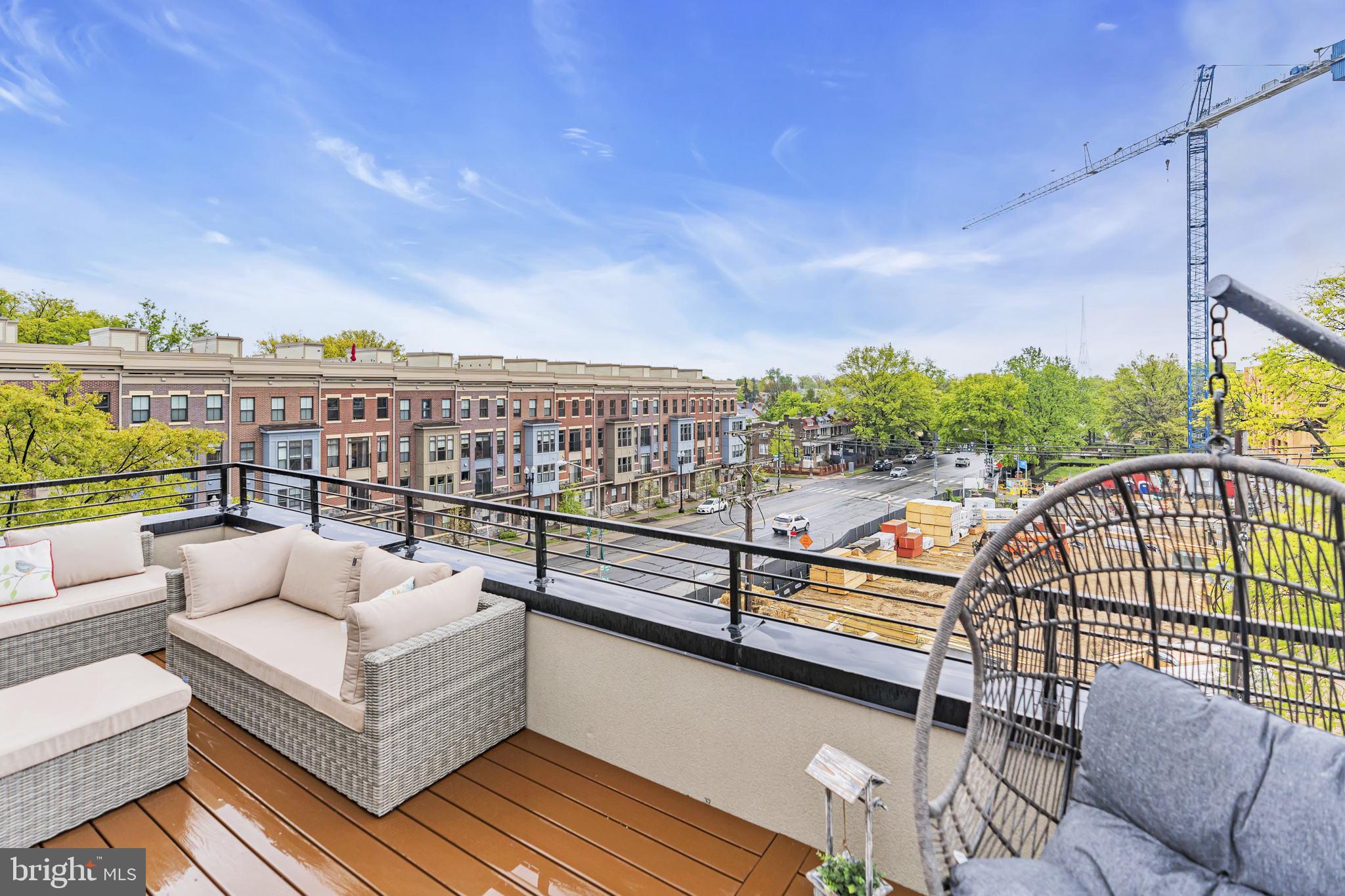 1103 Fern Street Northwest, Unit 301 Washington, DC 20012 - Photo 44 of 57 a view of a balcony with furniture