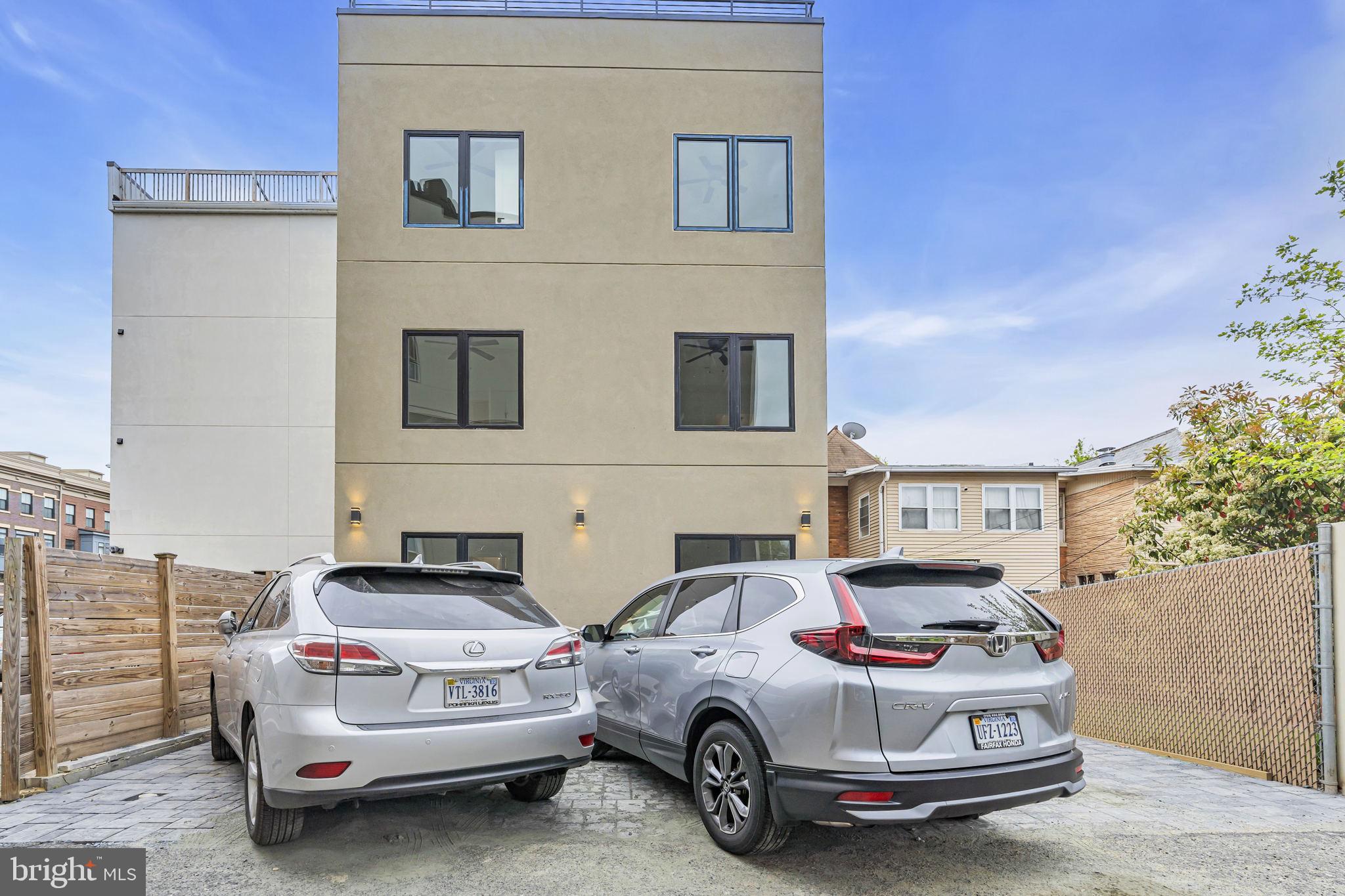 1103 Fern Street Northwest, Unit 301 Washington, DC 20012 - Photo 56 of 57 a car parked in front of a house