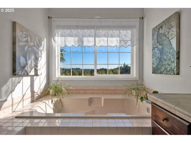 a bathroom with a granite countertop toilet a sink and a mirror