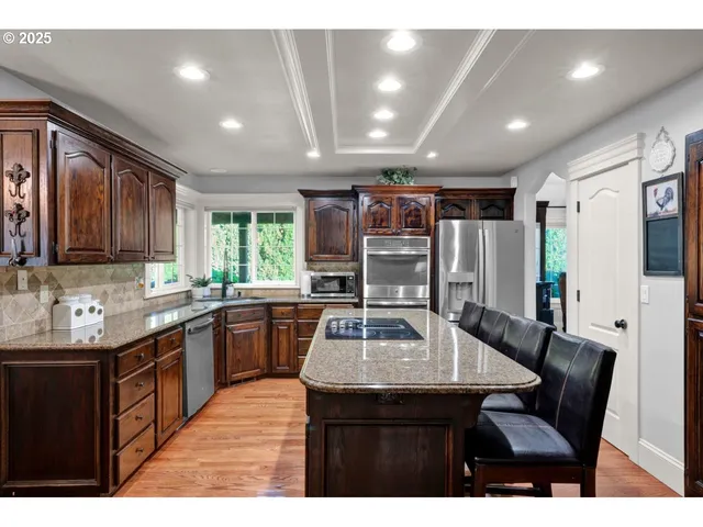 a kitchen with a sink cabinets and refrigerator