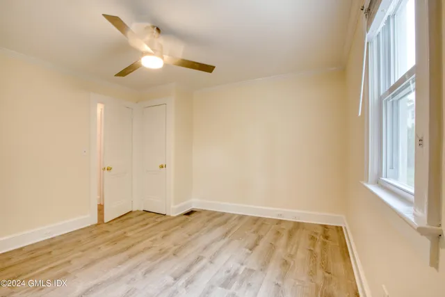 a view of empty room with wooden walls