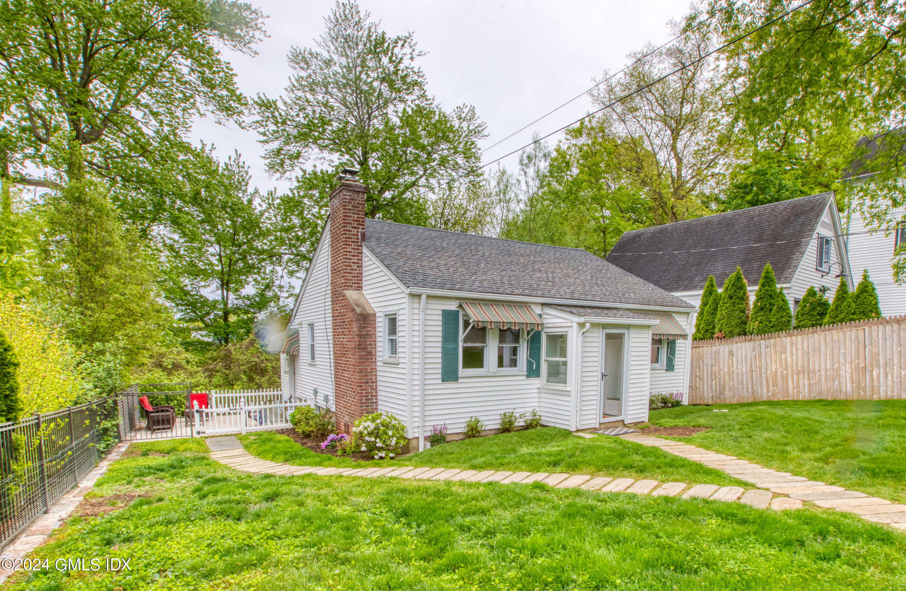 4 R Highview Avenue Old Greenwich, CT 06870 - Photo 16 of 21 a front view of a house with a yard