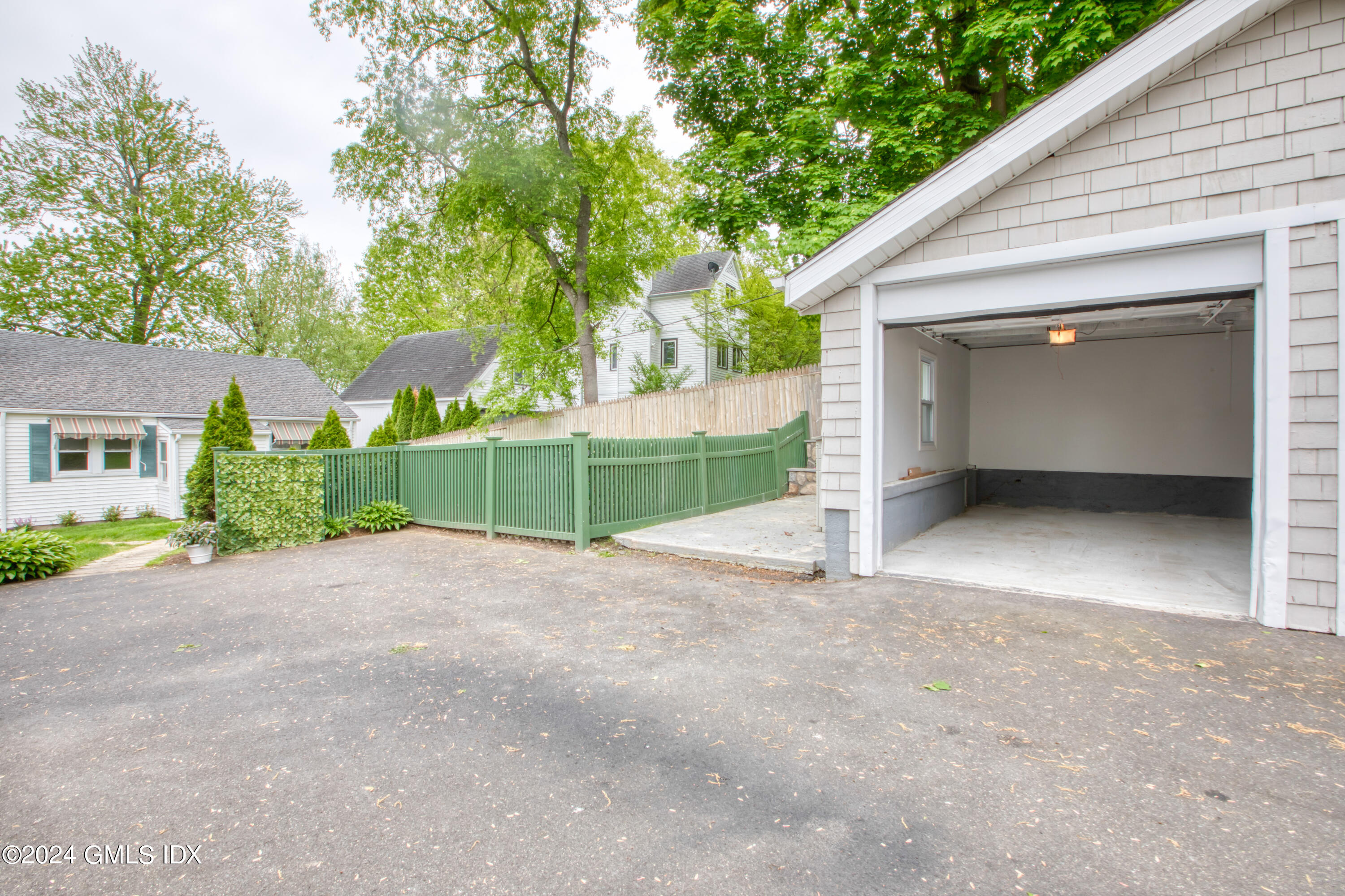 4 R Highview Avenue Old Greenwich, CT 06870 - Photo 17 of 21 a view of a house with a yard and garage