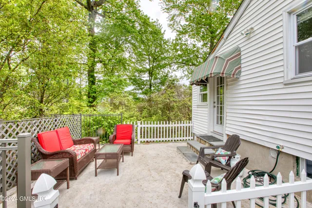 a patio with table and chairs