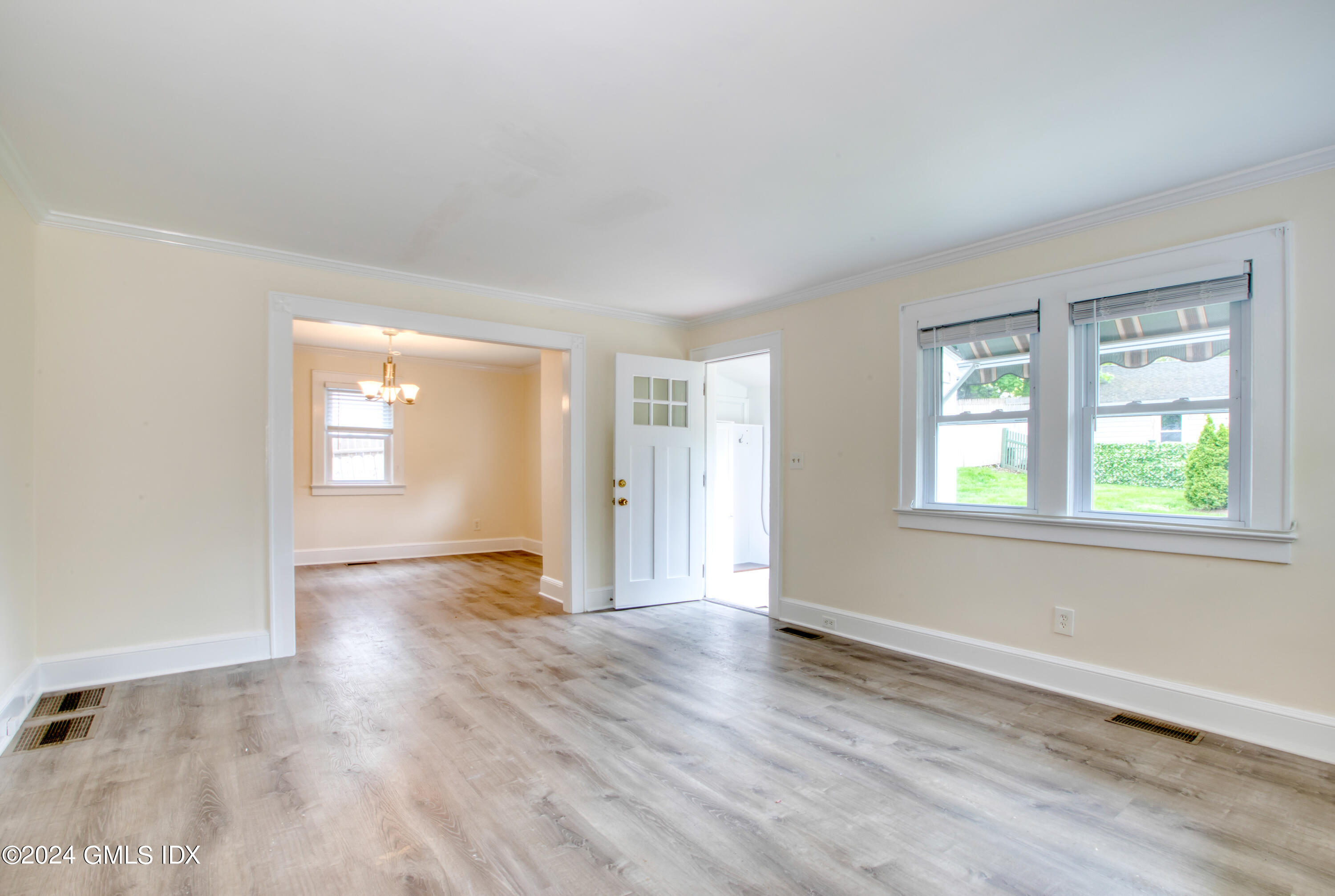 4 R Highview Avenue Old Greenwich, CT 06870 - Photo 5 of 21 an empty room with wooden floor and windows