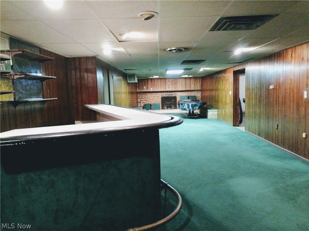 1872 Meloy Road Kent, OH 44240 - Photo 11 of 15 Partially finished basement w/ bar & fireplace.