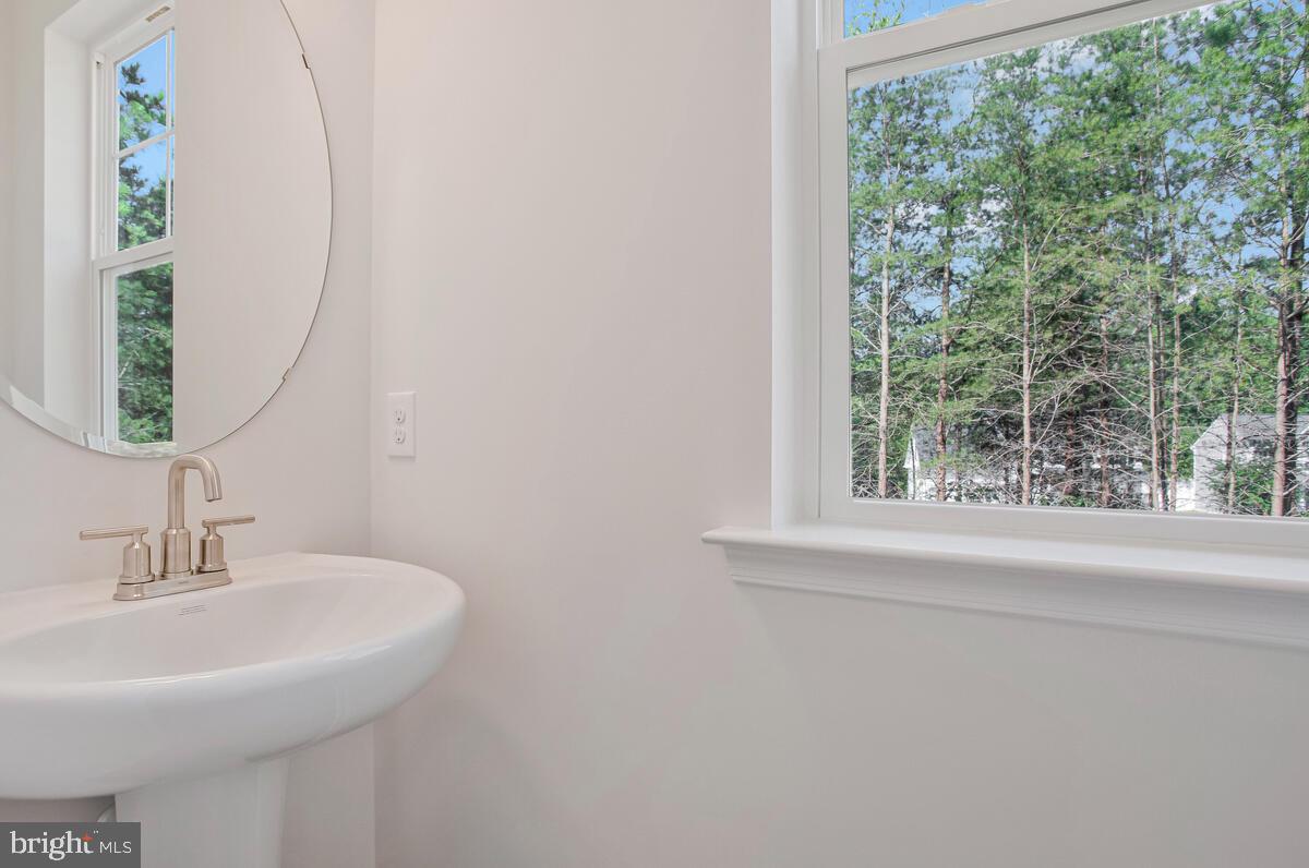 721 Nollmeyer Road Middle River, MD 21220 - Photo 18 of 33 a bathroom with a sink and a mirror