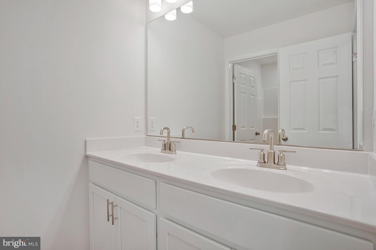 721 Nollmeyer Road Middle River, MD 21220 - Photo 26 of 33 a bathroom with a sink and a mirror
