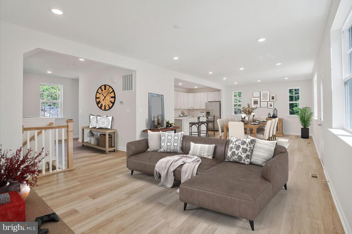 721 Nollmeyer Road Middle River, MD 21220 - Photo 5 of 33 a living room with furniture and a wooden floor