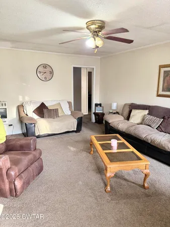 a living room with furniture and a table