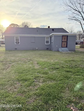 a view of a house with a garden