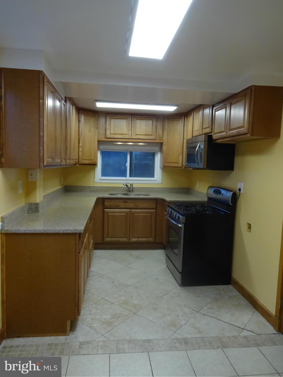 1631 Williams Avenue Baltimore, MD 21221 - Photo 6 of 28 New Kitchen w/ Granite Counters and Ceramic Floor