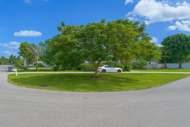 a view of a golf course with a house